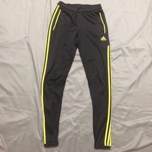 Adidas pants with yellow strips